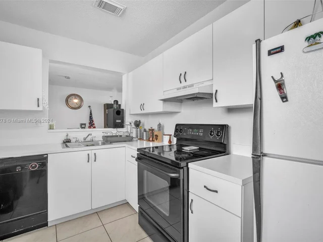 1126 NW 125th Path # 203, Miami FL 33182