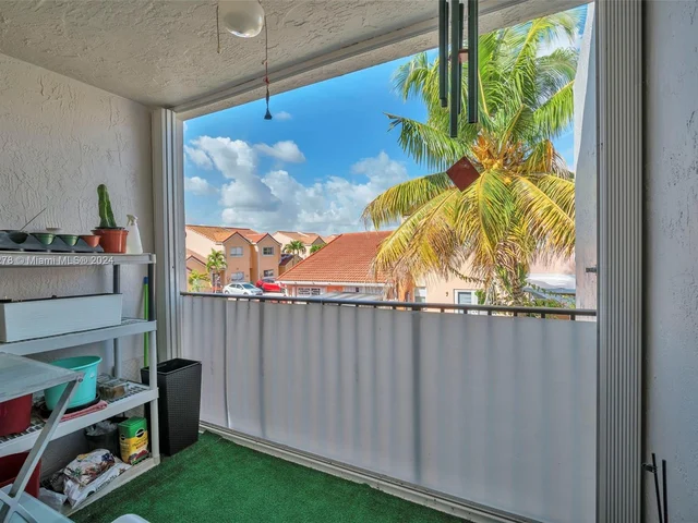 1126 NW 125th Path # 203, Miami FL 33182